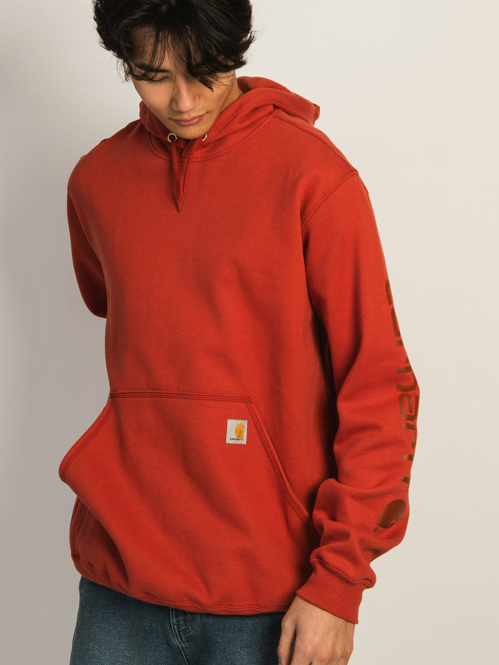 CARHARTT LOGO SLEEVE GRAPHIC PULL OVER HOODIE - SADDLE RED
