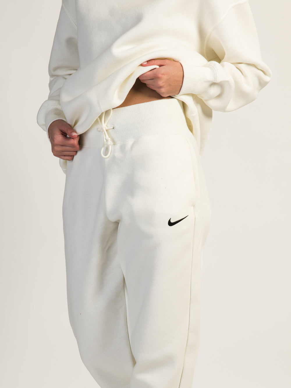 Nike mini swoosh oversized jogger in off white
