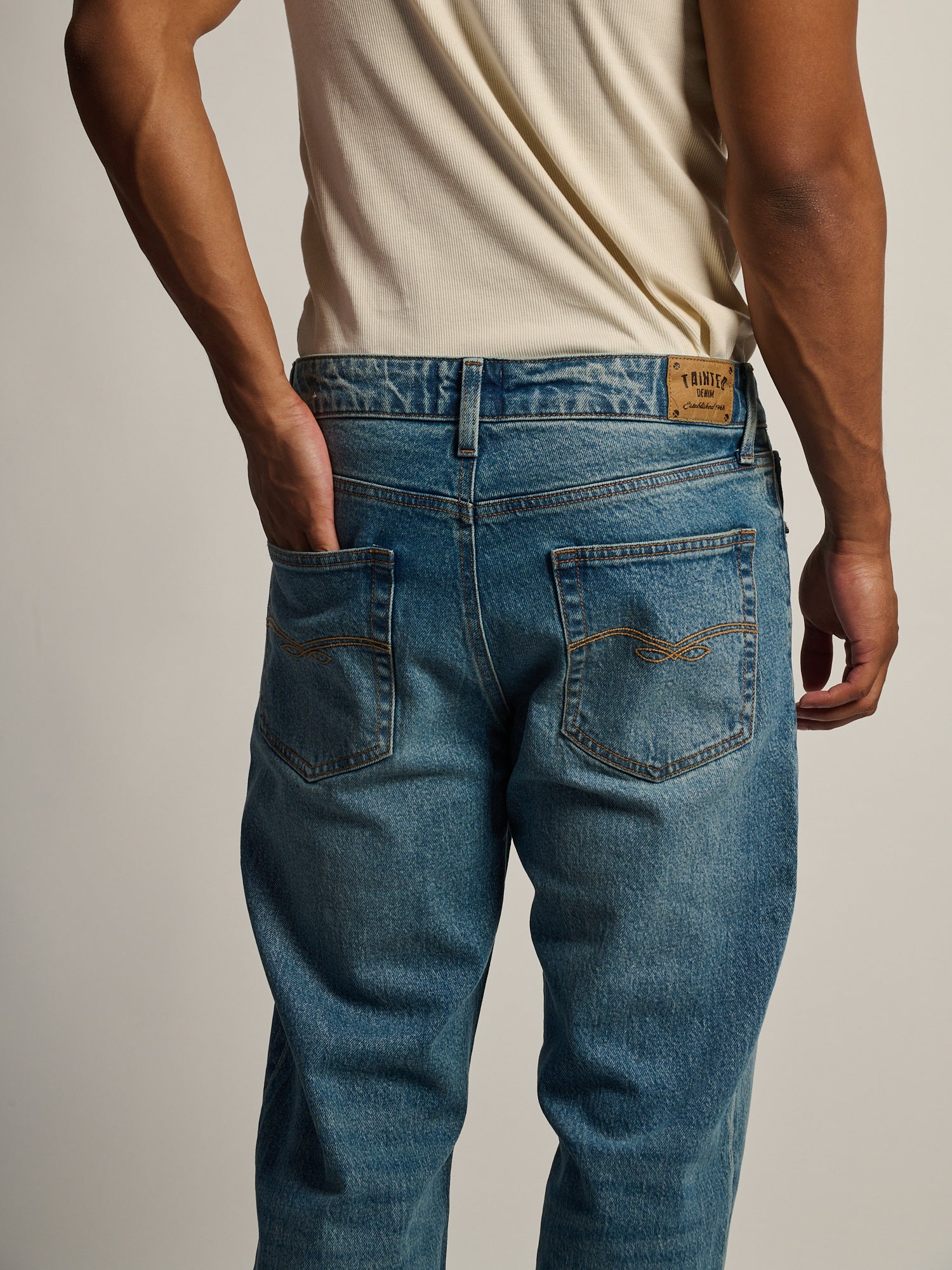 TAINTED BOOT CUT JEAN - MIDWASH