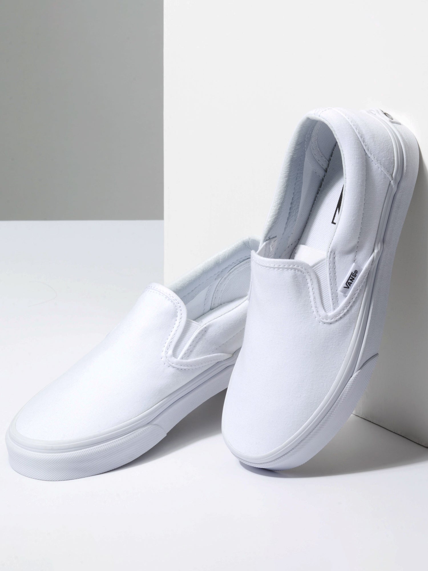 White slip on store canvas sneakers