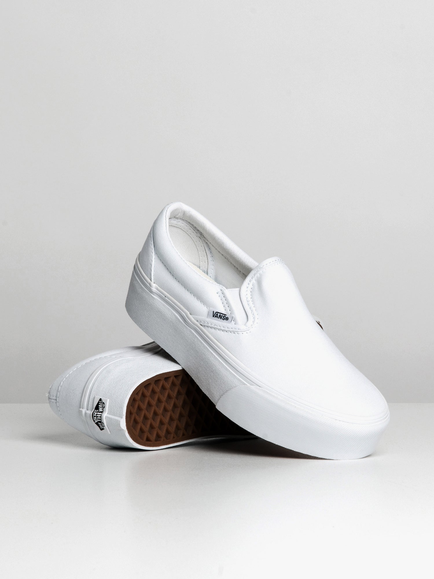 Platform slip on sale on vans white