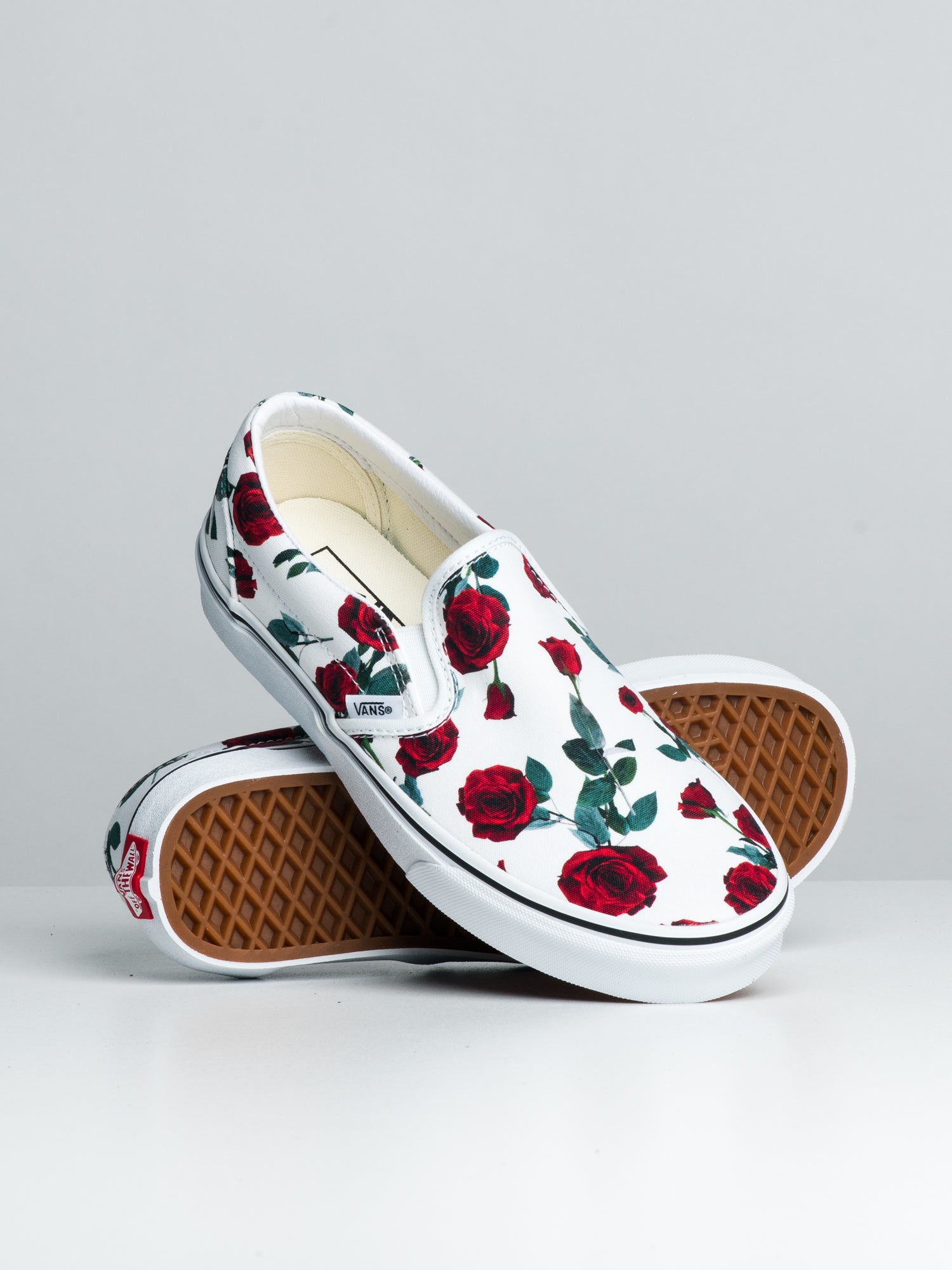 White vans store with red roses